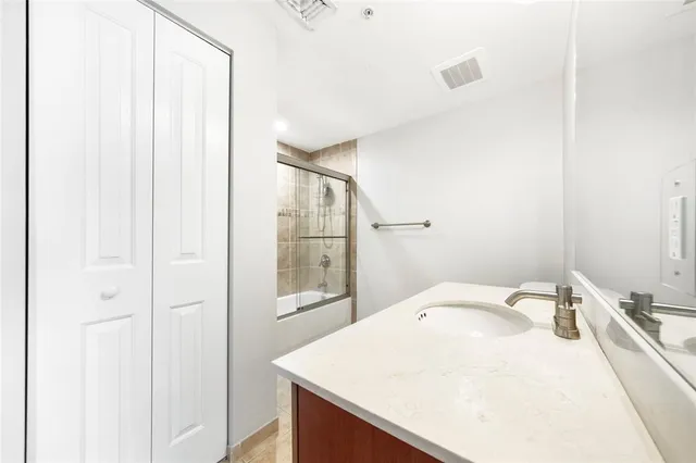 a bathroom with a sink and mirror