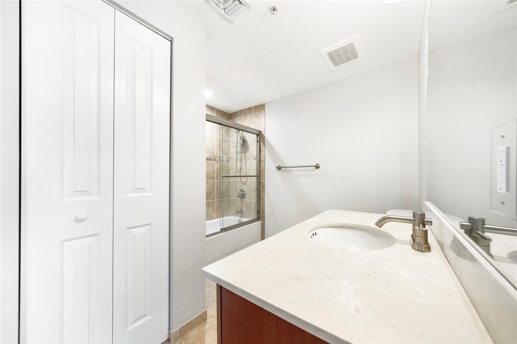 511 Southeast 5th Avenue, Unit 1116 Fort Lauderdale, FL 33301 - Photo 36 of 45 a bathroom with a sink and mirror