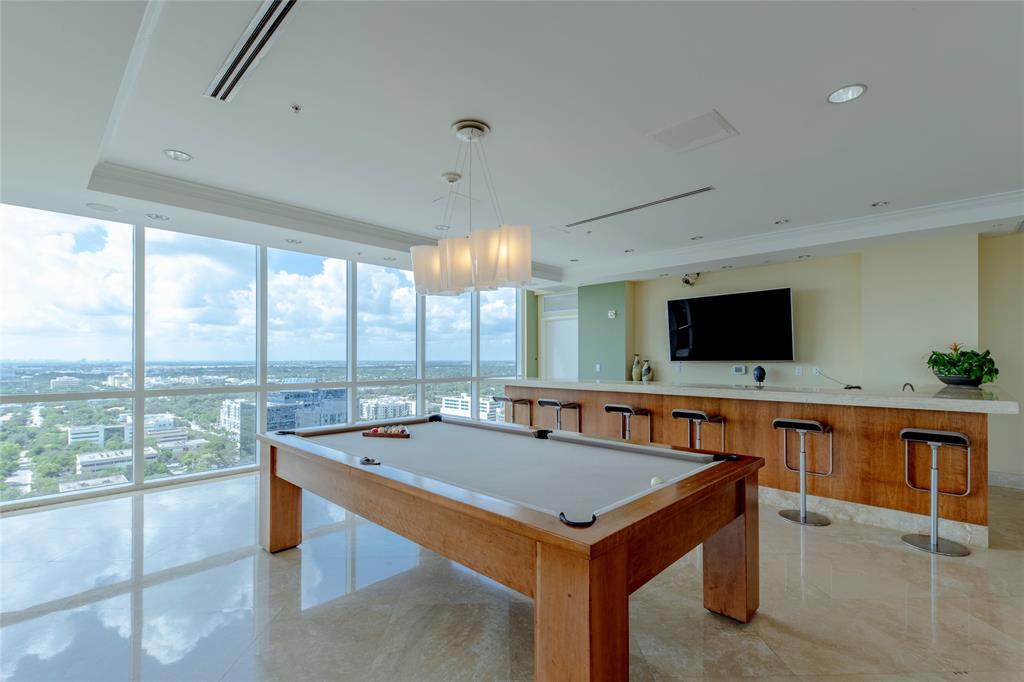 511 Southeast 5th Avenue, Unit 1116 Fort Lauderdale, FL 33301 - Photo 38 of 45 a view of a kitchen with a table and chairs