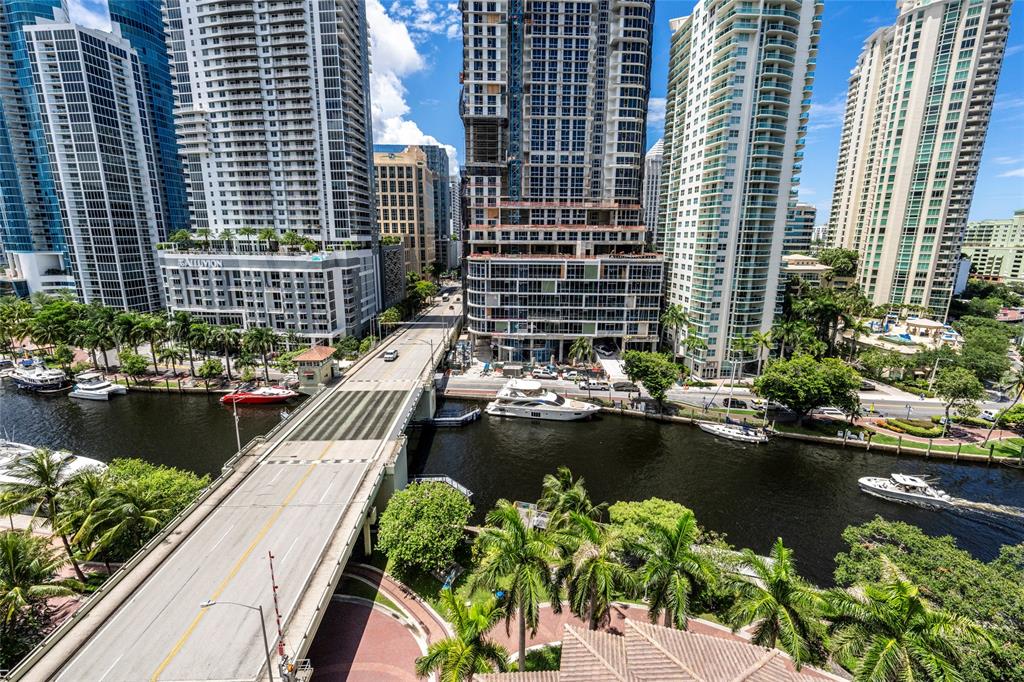 511 Southeast 5th Avenue, Unit 1116 Fort Lauderdale, FL 33301 - Photo 44 of 45 a view of a lake with a couple of cars parked in a balcony