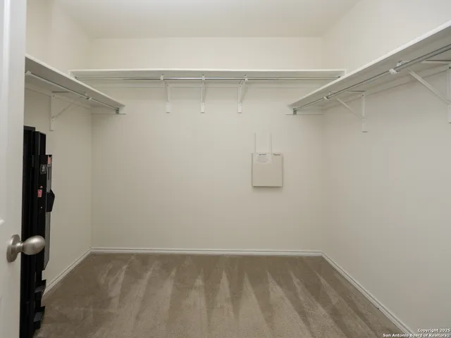 a view of an empty walk in closet