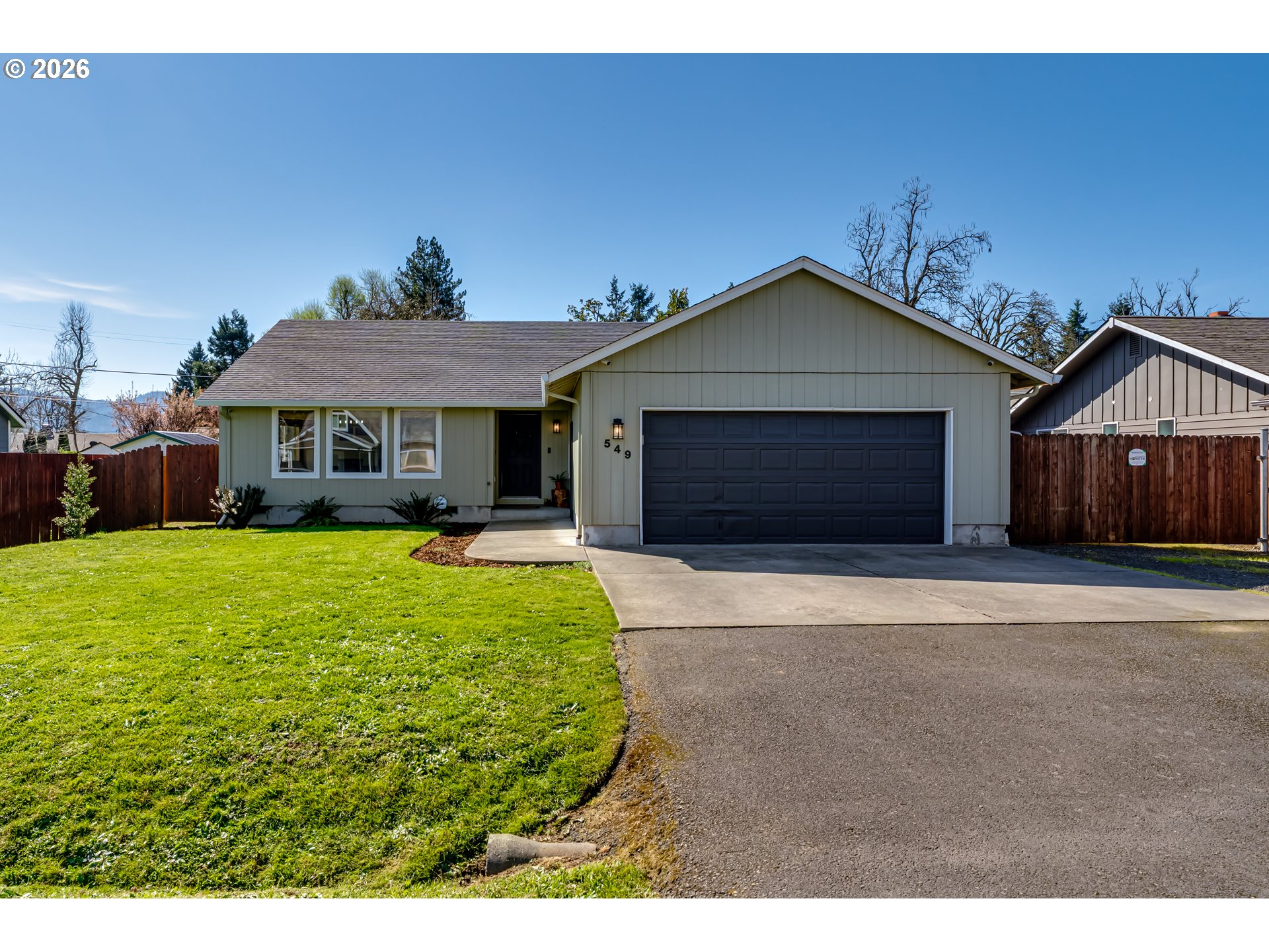549 Gilfry Avenue Creswell, OR 97426 - Photo 1 of 44 a front view of a house with a yard and garage