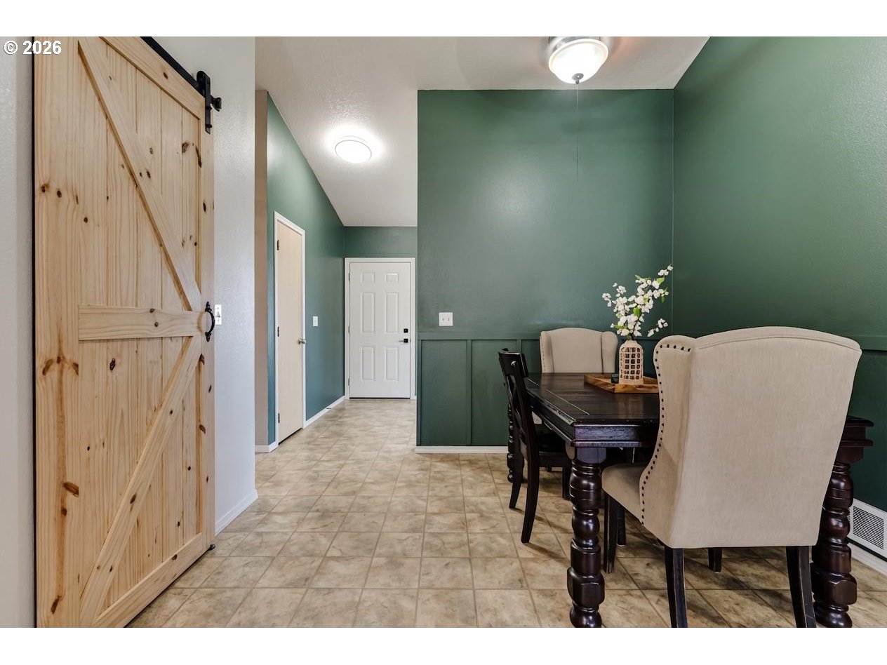 549 Gilfry Avenue Creswell, OR 97426 - Photo 12 of 44 a view of a dining room with furniture