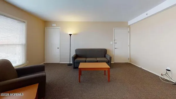 a room with furniture and a window