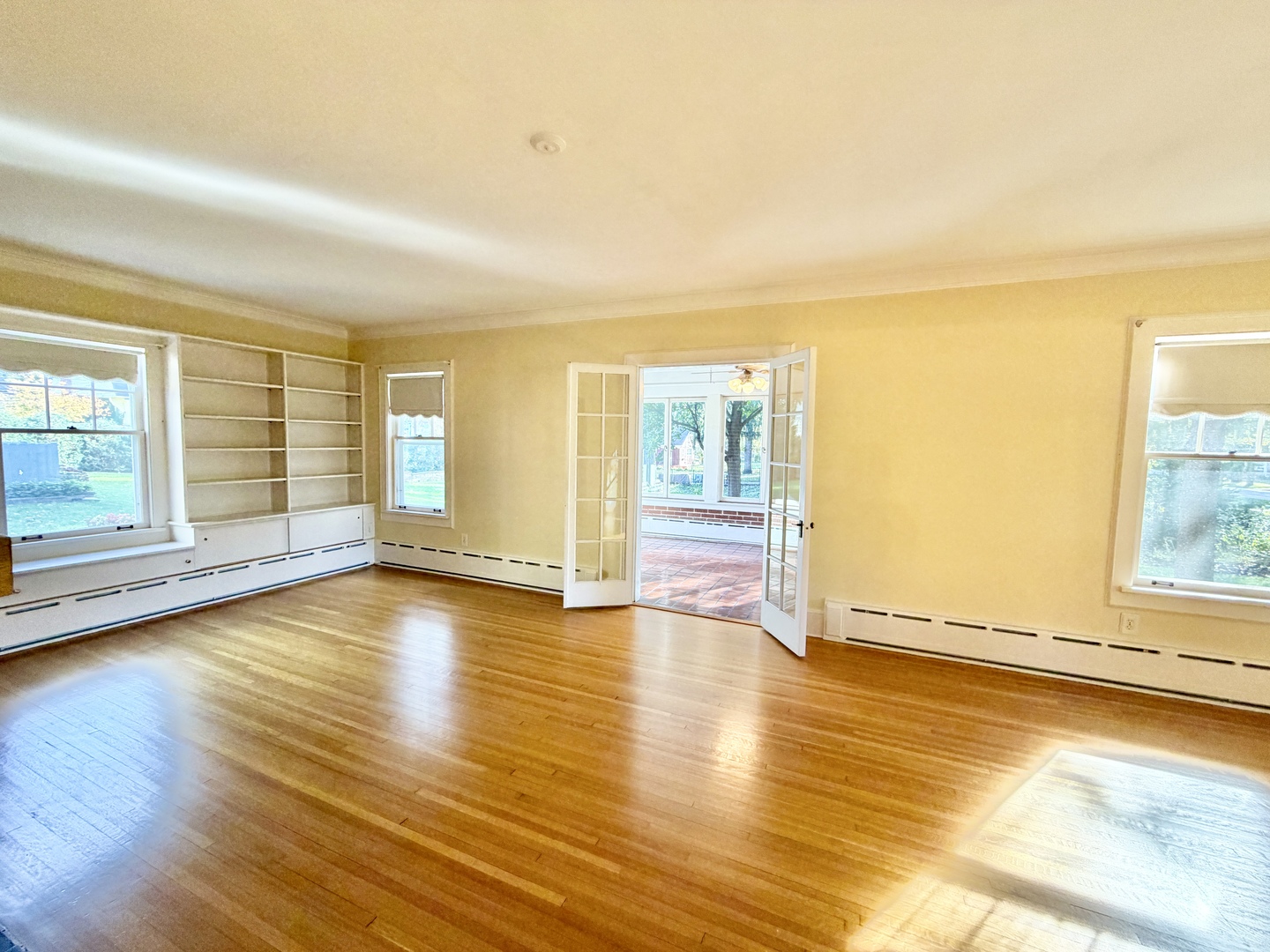 841 Douglas Avenue Elgin, IL 60120 - Photo 14 of 75 a view of an empty room with wooden floor and a window