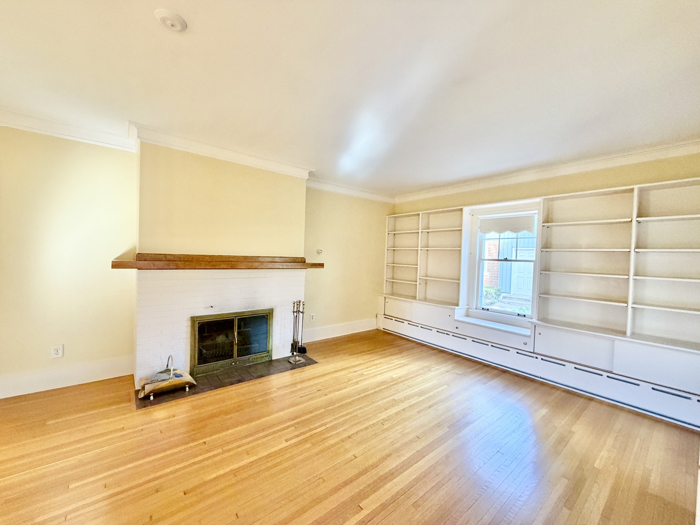 841 Douglas Avenue Elgin, IL 60120 - Photo 15 of 75 an empty room with wooden floor fireplace and windows
