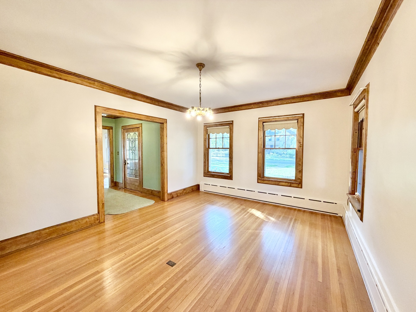 841 Douglas Avenue Elgin, IL 60120 - Photo 23 of 75 a view of an empty room with wooden floor and a window