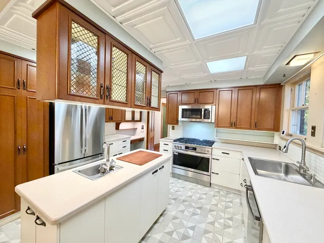 a bathroom with a sink toilet and mirror