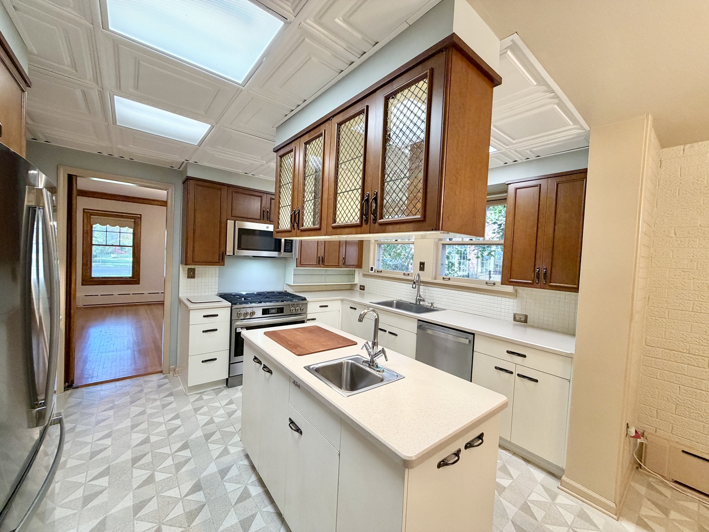 841 Douglas Avenue Elgin, IL 60120 - Photo 30 of 75 a kitchen that has a sink a stove and a refrigerator
