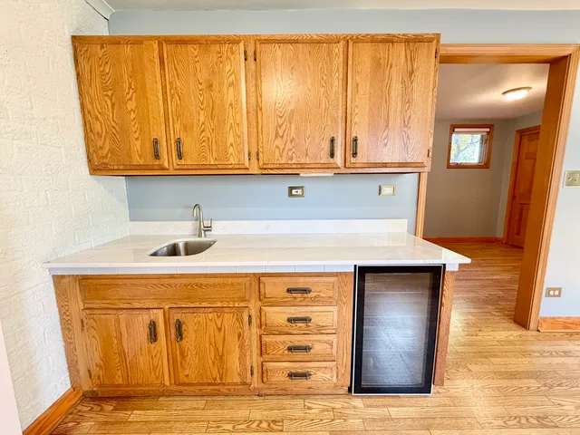 a bathroom with a sink a toilet a mirror and shower