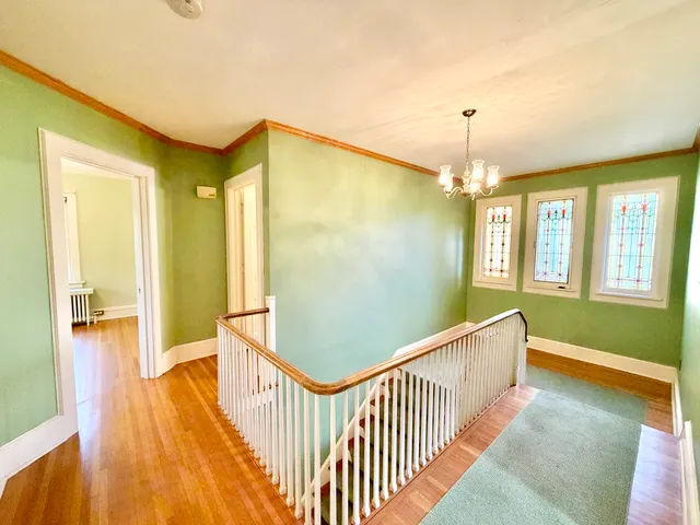 a view of entryway with wooden floor