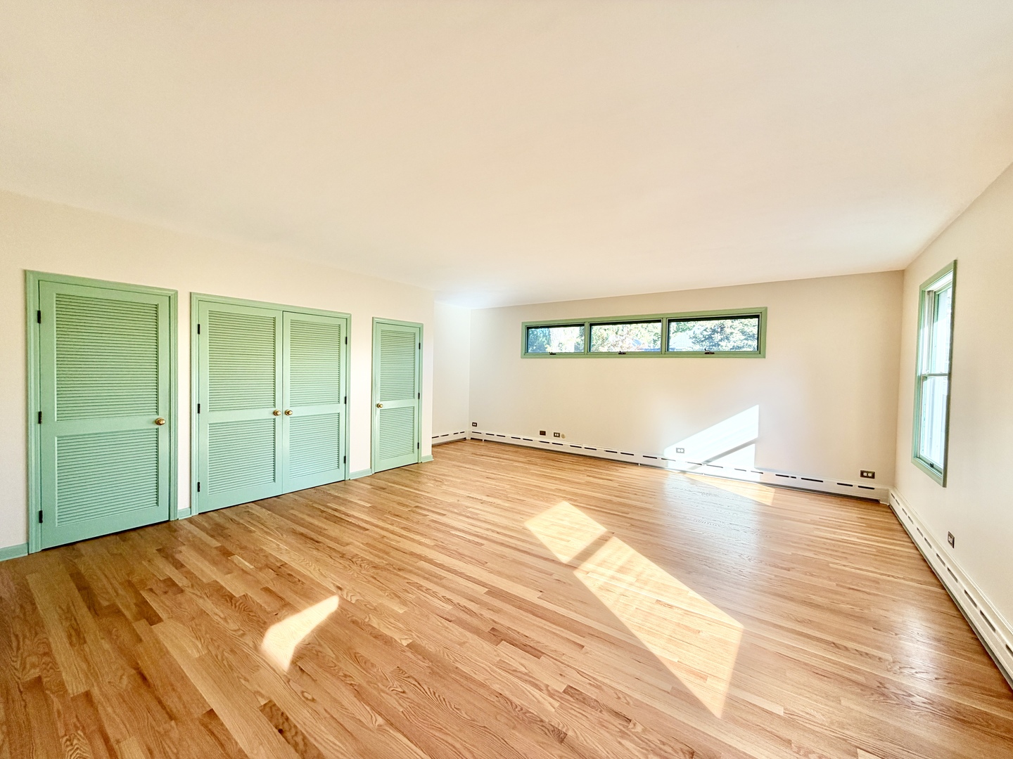 841 Douglas Avenue Elgin, IL 60120 - Photo 47 of 75 a view of an empty room with wooden floor and a window