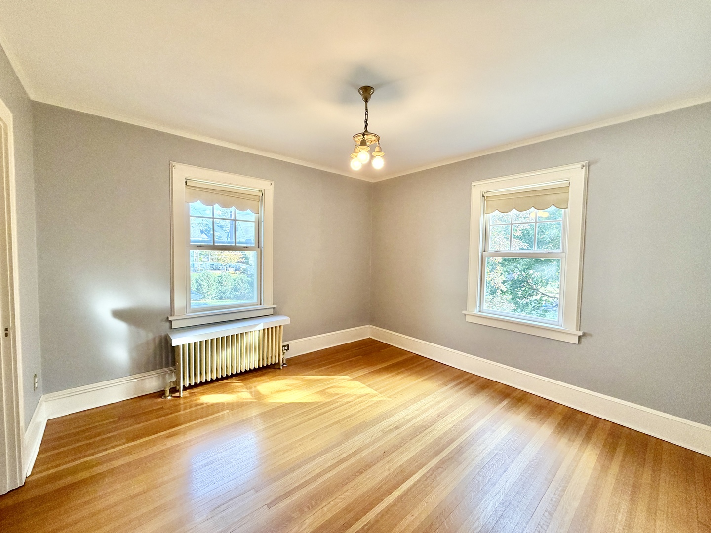 841 Douglas Avenue Elgin, IL 60120 - Photo 59 of 75 a view of an empty room with wooden floor and a window