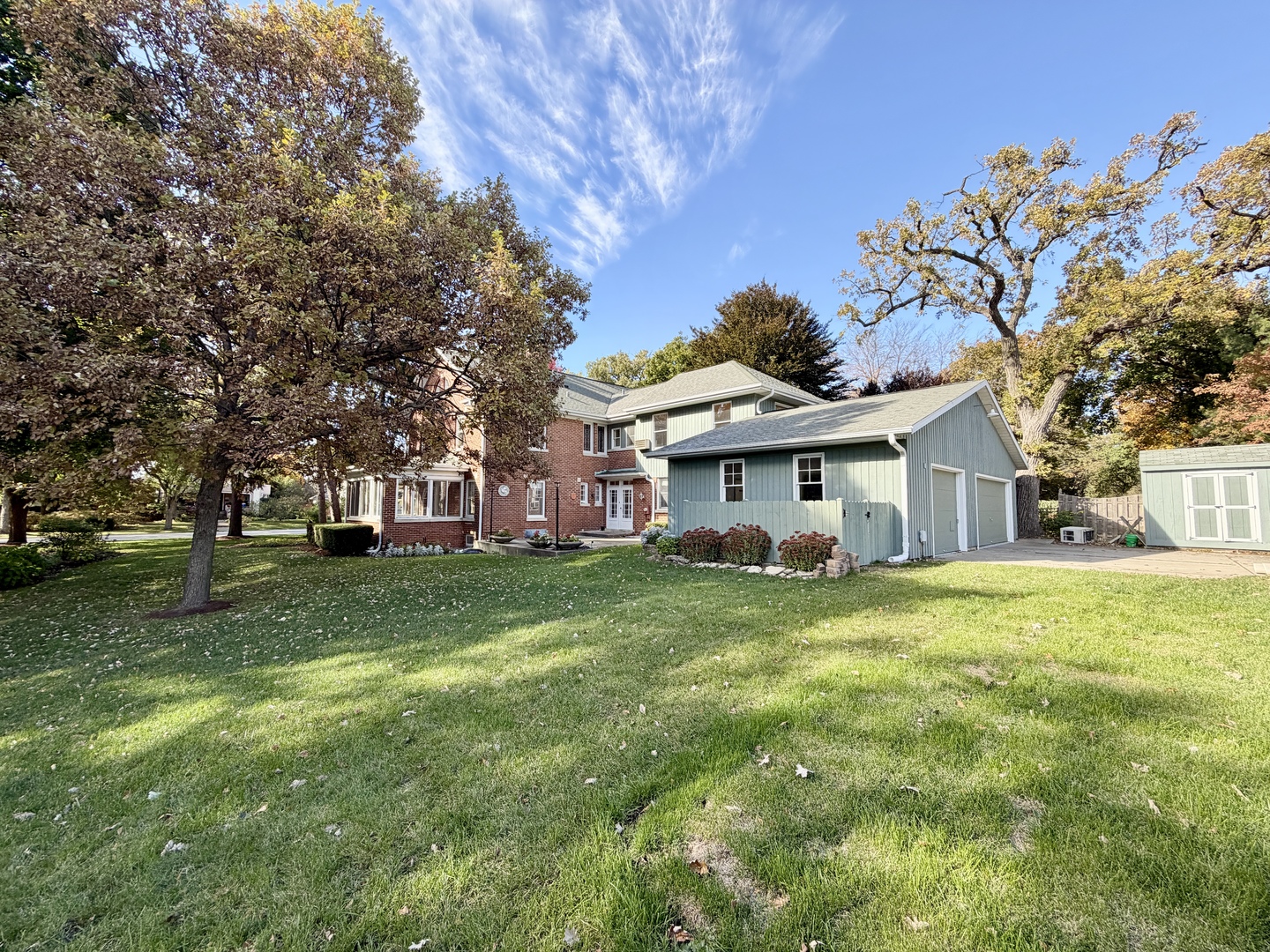 841 Douglas Avenue Elgin, IL 60120 - Photo 75 of 75 a view of a house with a big yard and large trees
