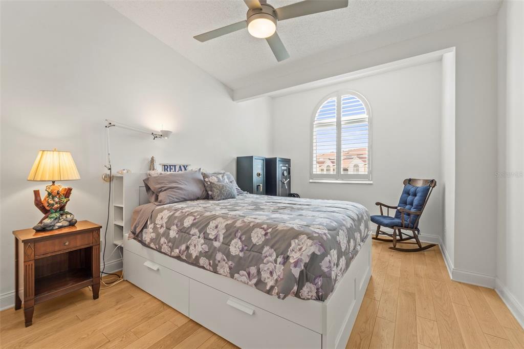 2385 Hanover Drive Dunedin, FL 34698 - Photo 37 of 87 a bedroom with a bed and a chandelier