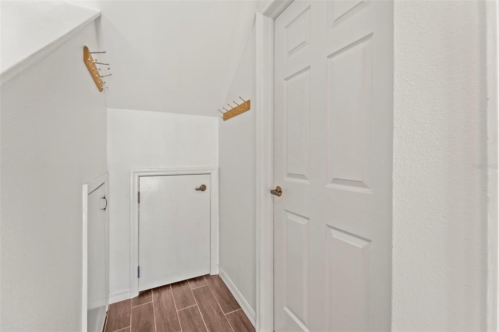 2385 Hanover Drive Dunedin, FL 34698 - Photo 60 of 87 a view of a hallway with wooden floor