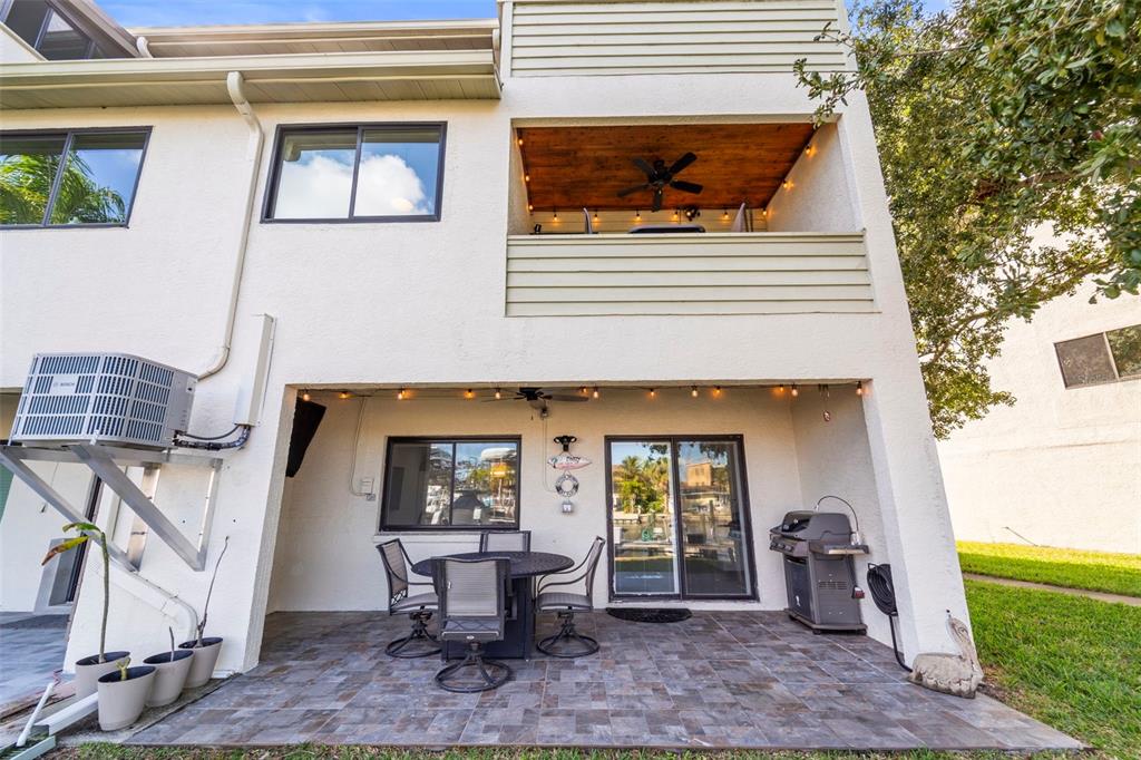 2385 Hanover Drive Dunedin, FL 34698 - Photo 83 of 87 a front view of a house with outdoor seating