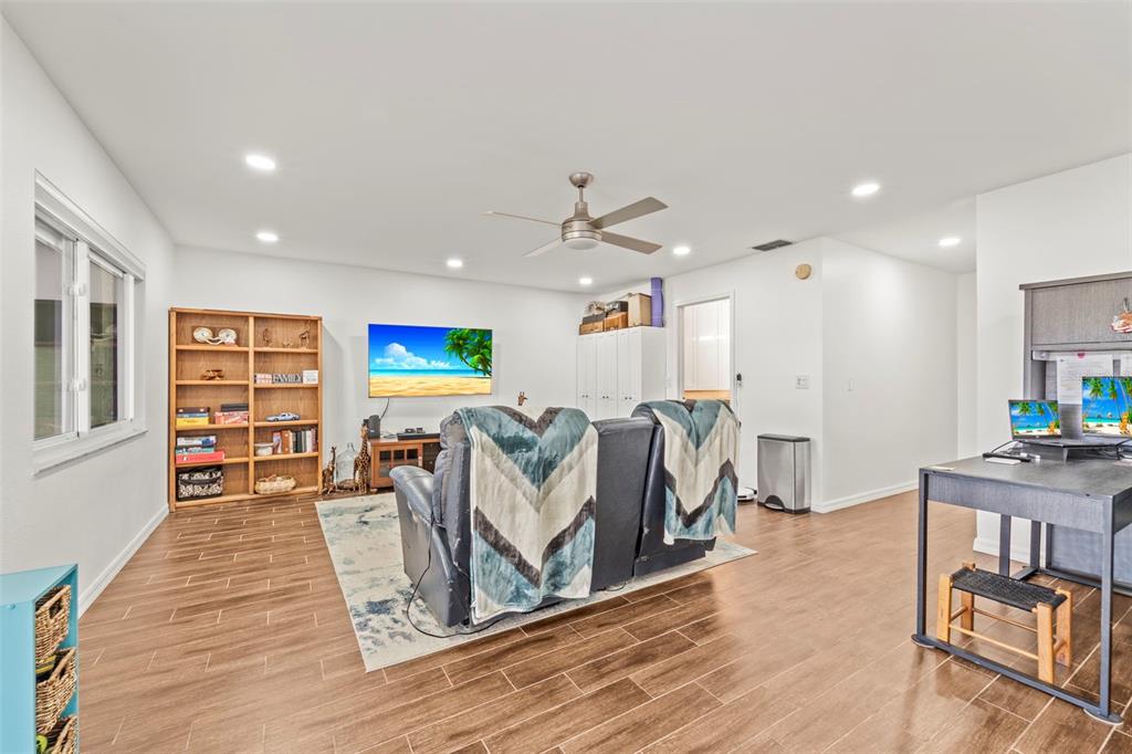 2385 Hanover Drive Dunedin, FL 34698 - Photo 9 of 87 a living room with furniture and a wooden floor