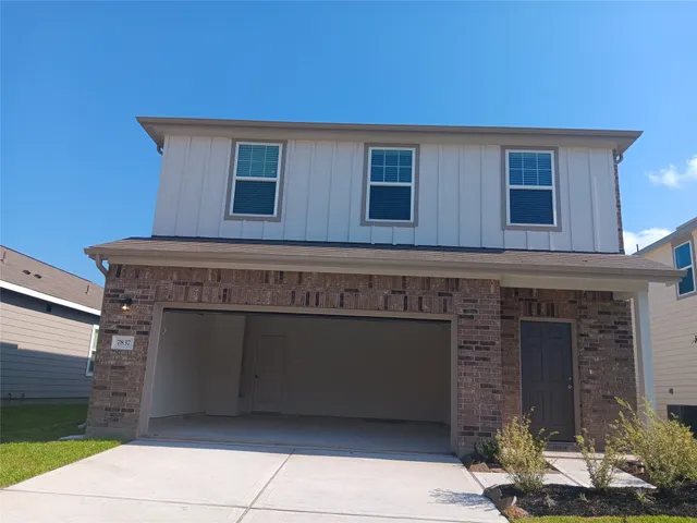 a view of a house with a garage
