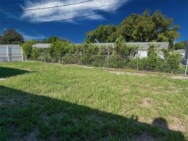 a view of a room with wooden door