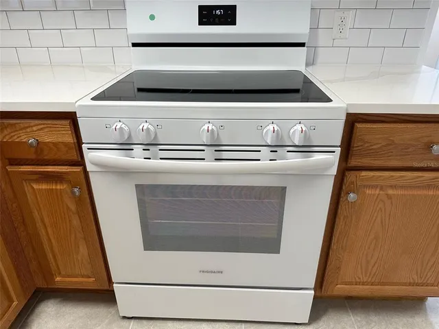 a white refrigerator freezer and a dishwasher sitting in a kitchen