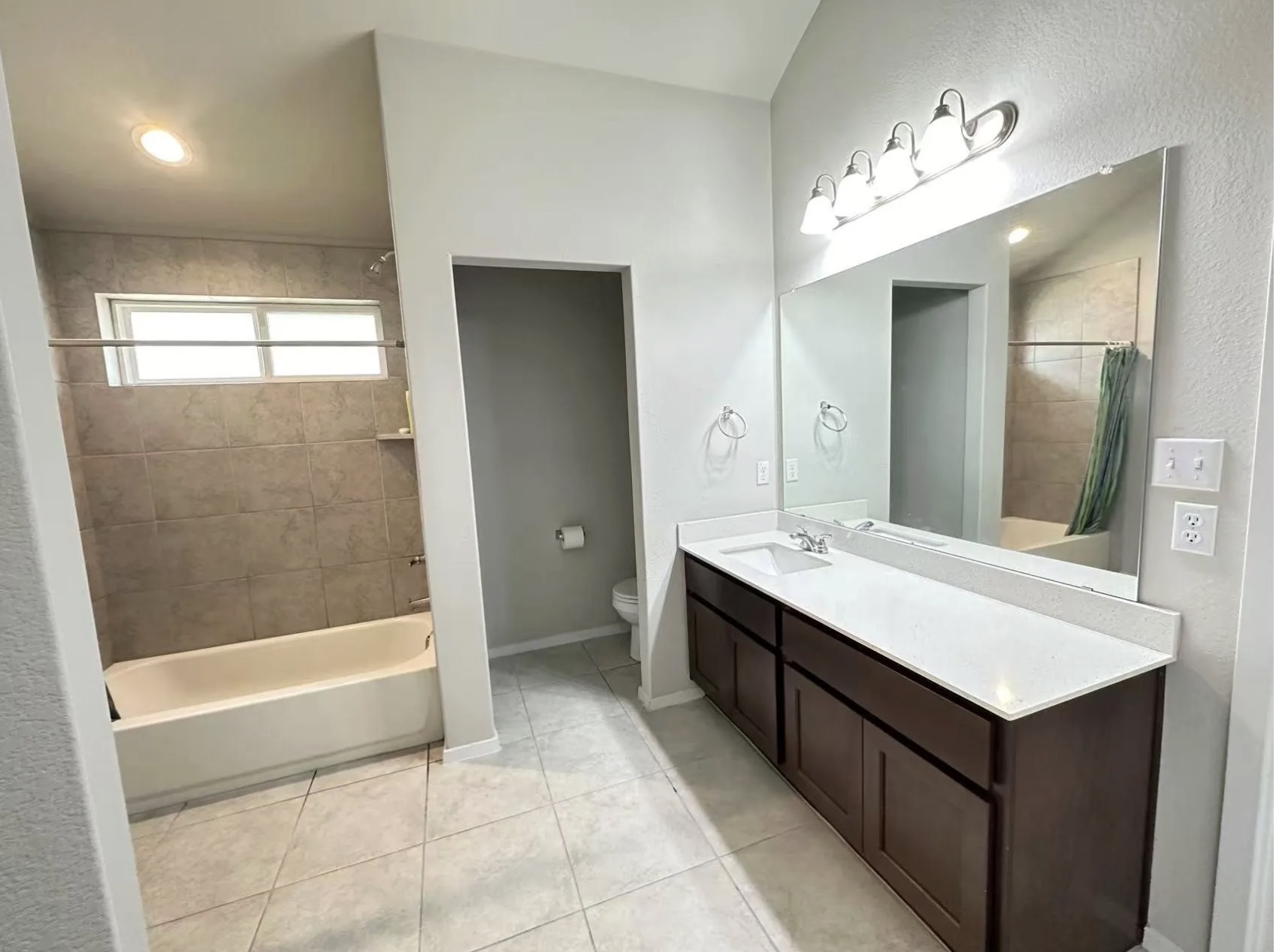 251 Tempest Trail Maxwell, TX 78656 - Photo 9 of 15 a bathroom with a bathtub a sink and a mirror