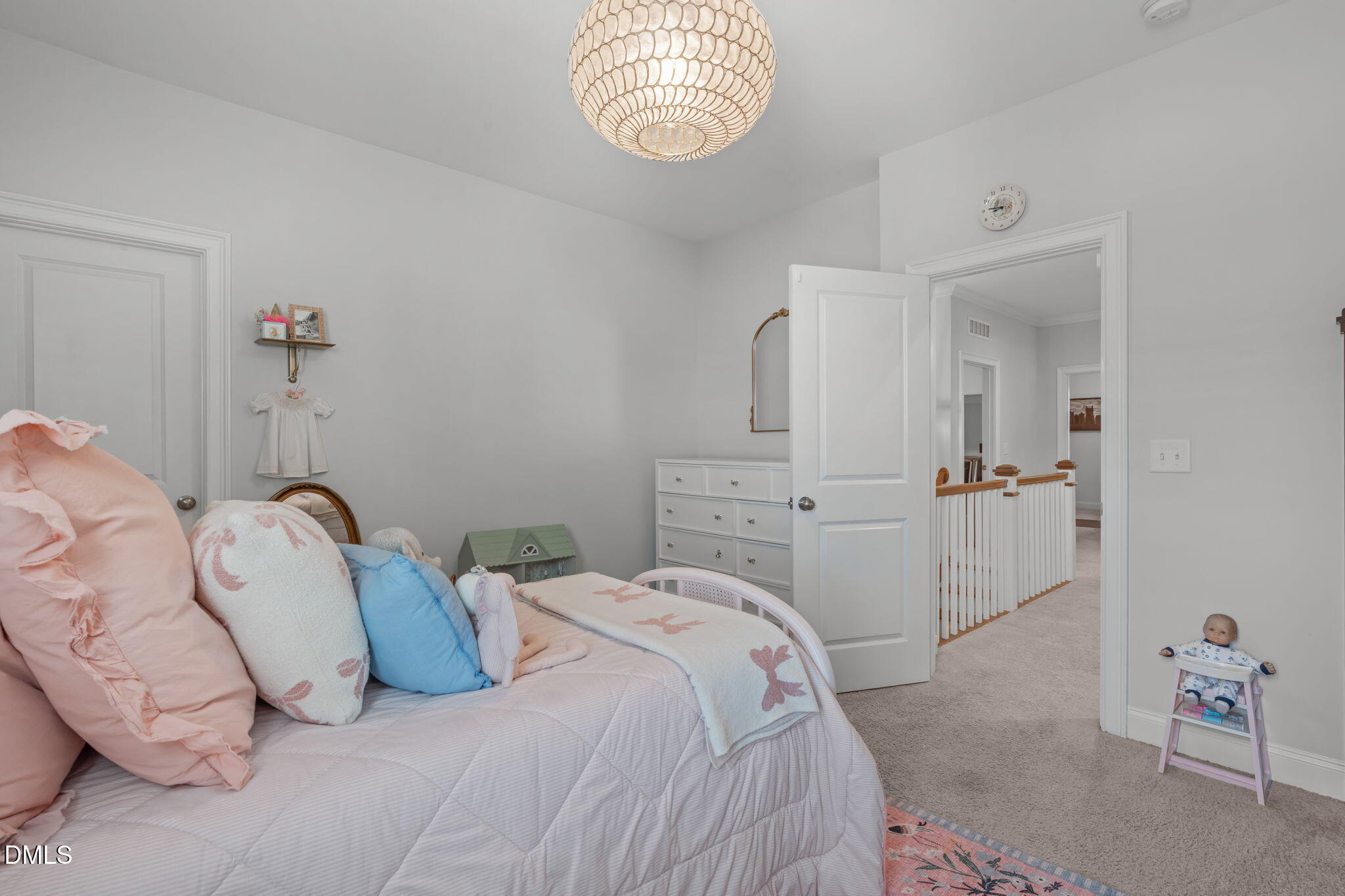 4144 Olde Judd Drive Willow Spring, NC 27592 - Photo 29 of 52 a bedroom with a bed and a chandelier