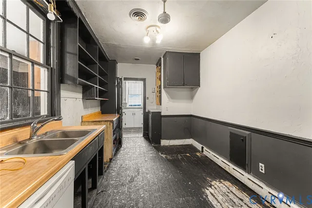 a kitchen that has a sink and a stove