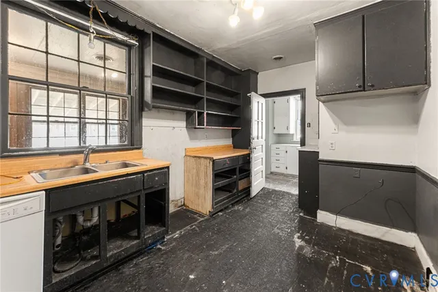 a kitchen that has a stove and a microwave