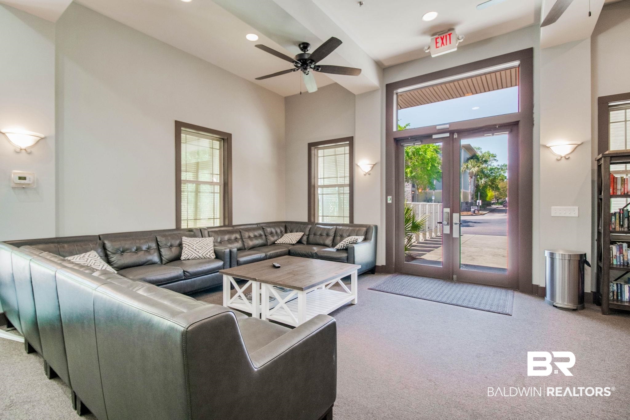 1430 Regency Road, Unit I201 Gulf Shores, AL 36542 - Photo 32 of 34 Carpeted living room with ceiling fan, french doors, and a high ceiling