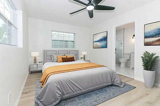 a bedroom with a bed and window