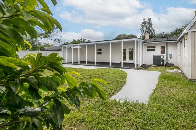 a backyard of a house with yard and garage