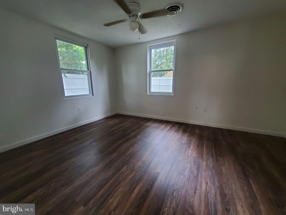 5 2nd Avenue Pemberton, NJ 08068 - Photo 6 of 11 a view of an empty room with wooden floor and a window