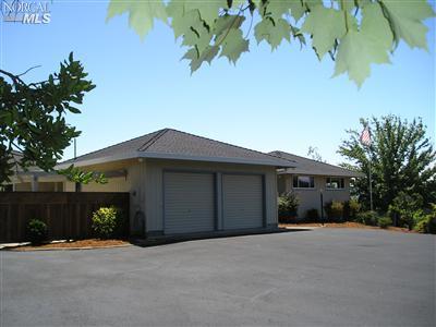 519 Grandview Road Sebastopol, CA 95472 - Photo 1 of 1 a front view of a house with a yard and garage