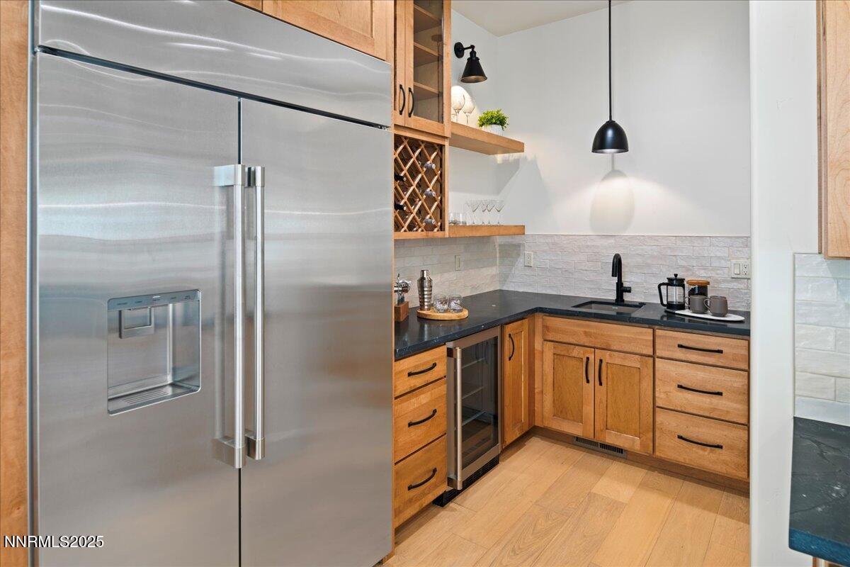 10755 Renegade Court Reno, NV 89511 - Photo 17 of 60 a kitchen with stainless steel appliances granite countertop a refrigerator and a sink