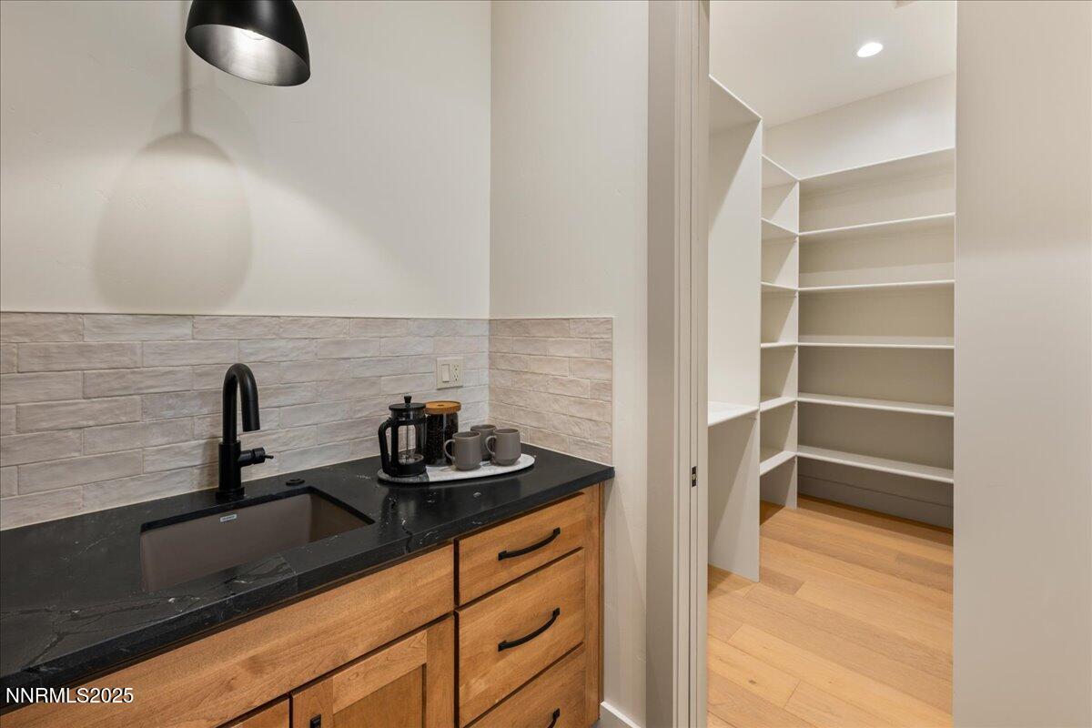 10755 Renegade Court Reno, NV 89511 - Photo 19 of 60 a kitchen with a sink and cabinets