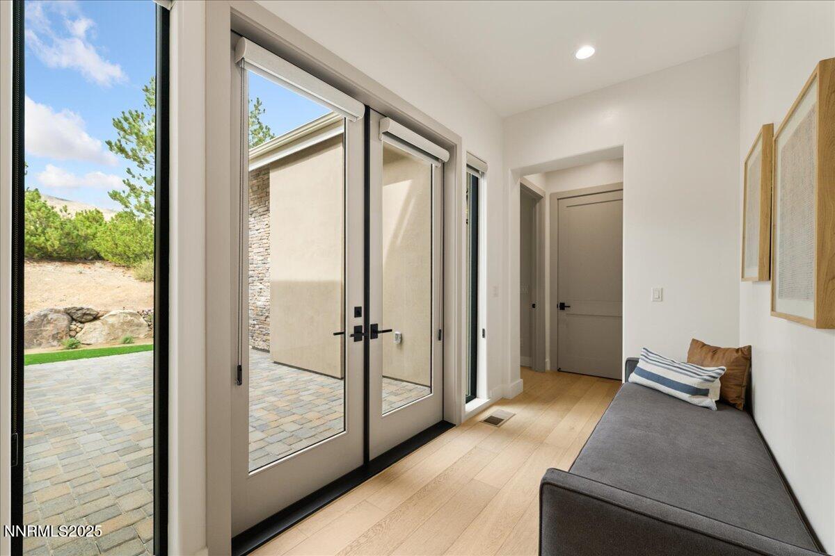 10755 Renegade Court Reno, NV 89511 - Photo 25 of 60 a view of a hallway with bathroom and glass door