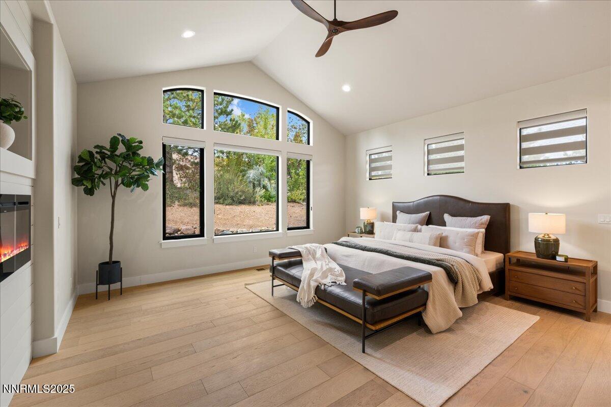 10755 Renegade Court Reno, NV 89511 - Photo 26 of 60 a spacious bedroom with a bed and a window
