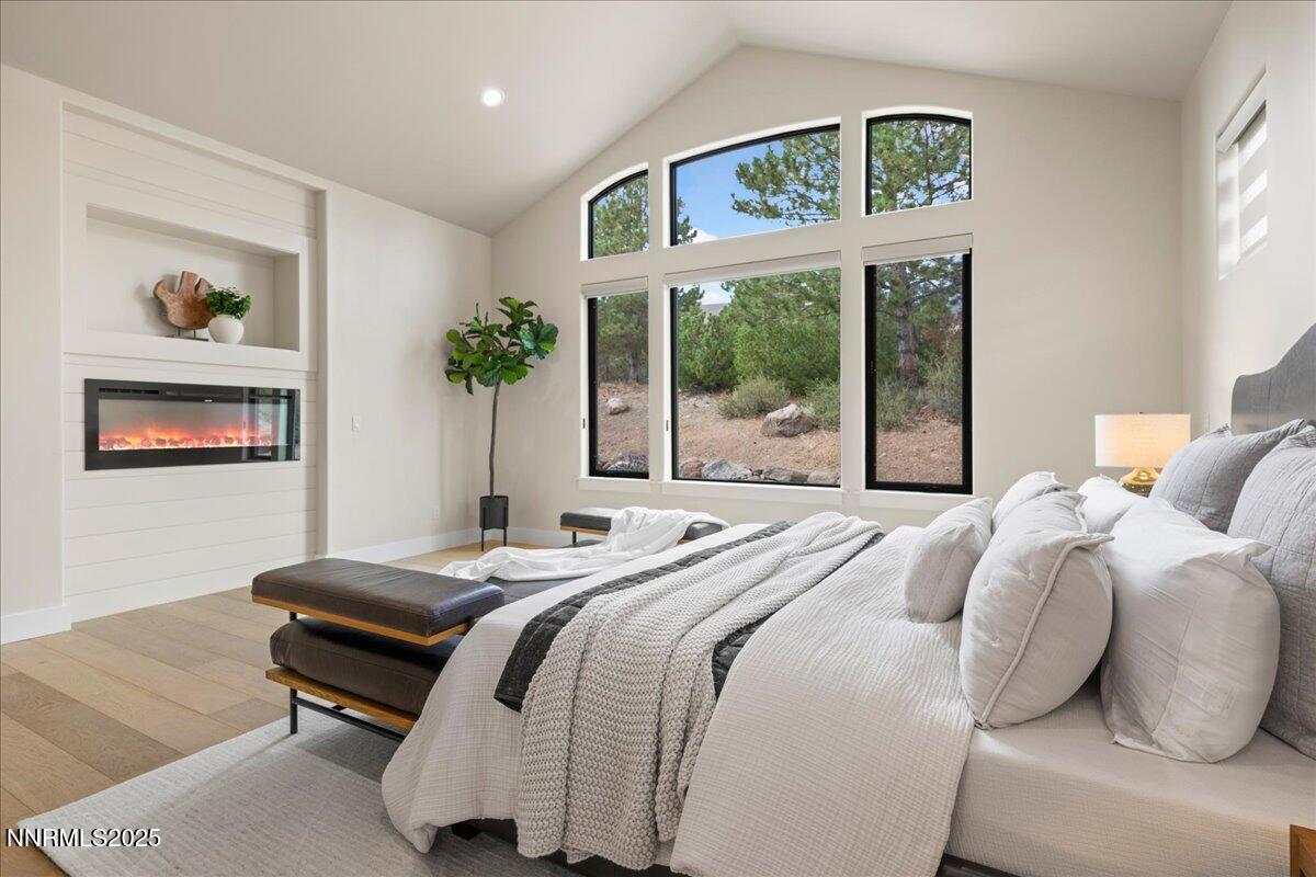 10755 Renegade Court Reno, NV 89511 - Photo 27 of 60 a bedroom with a bed and a large window