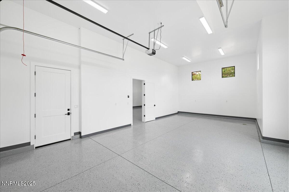 10755 Renegade Court Reno, NV 89511 - Photo 46 of 60 a view of a kitchen with wooden floor and white walls