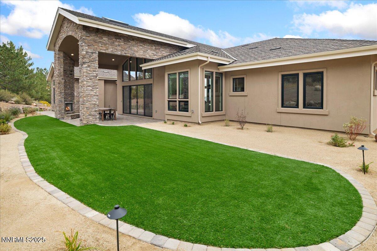 10755 Renegade Court Reno, NV 89511 - Photo 53 of 60 a view of a house with a backyard