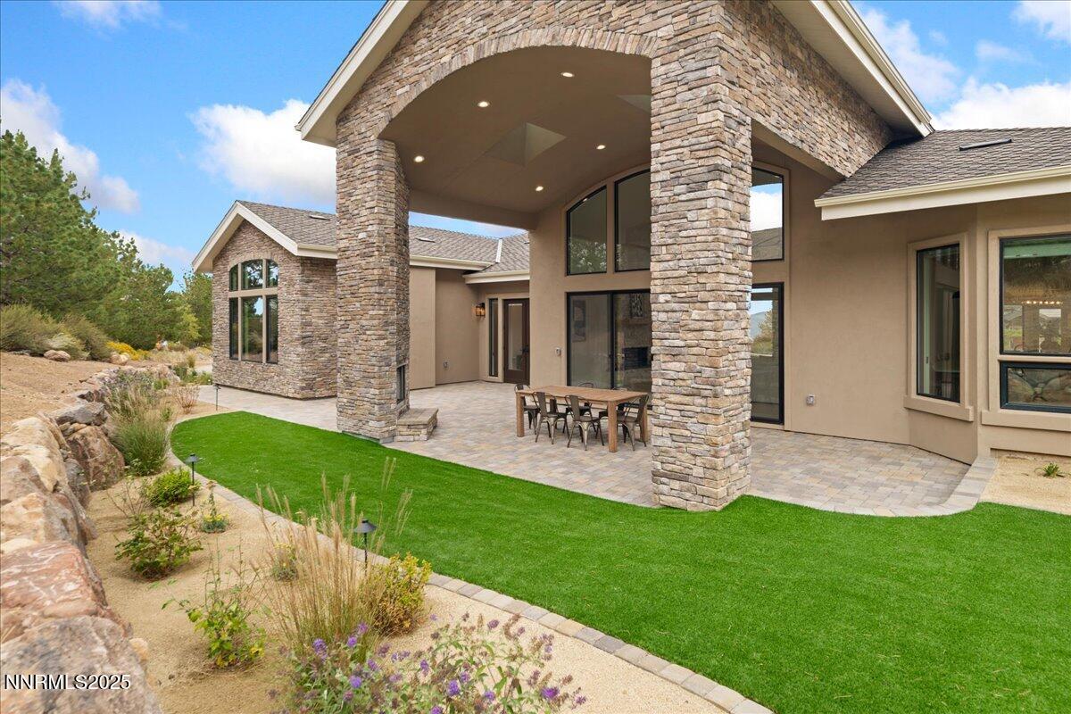 10755 Renegade Court Reno, NV 89511 - Photo 54 of 60 a front view of a house with a yard and garage
