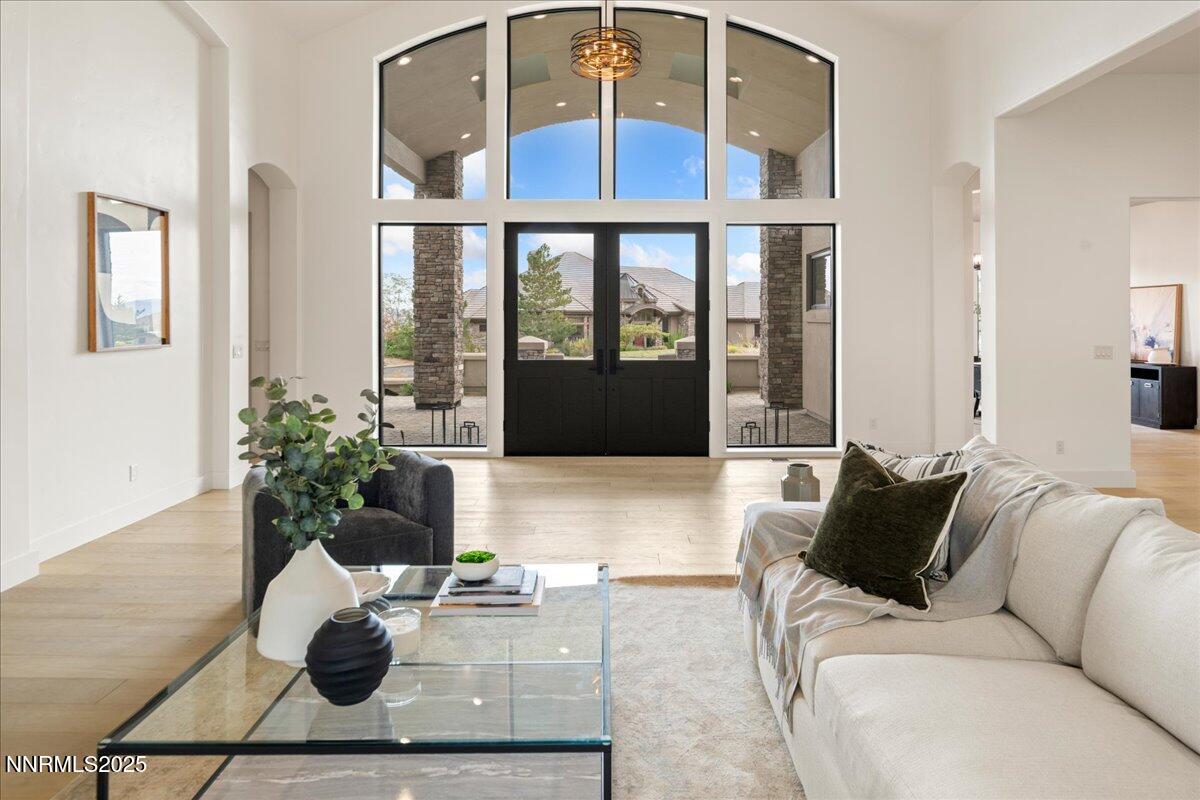 10755 Renegade Court Reno, NV 89511 - Photo 6 of 60 a living room with furniture and a potted plant