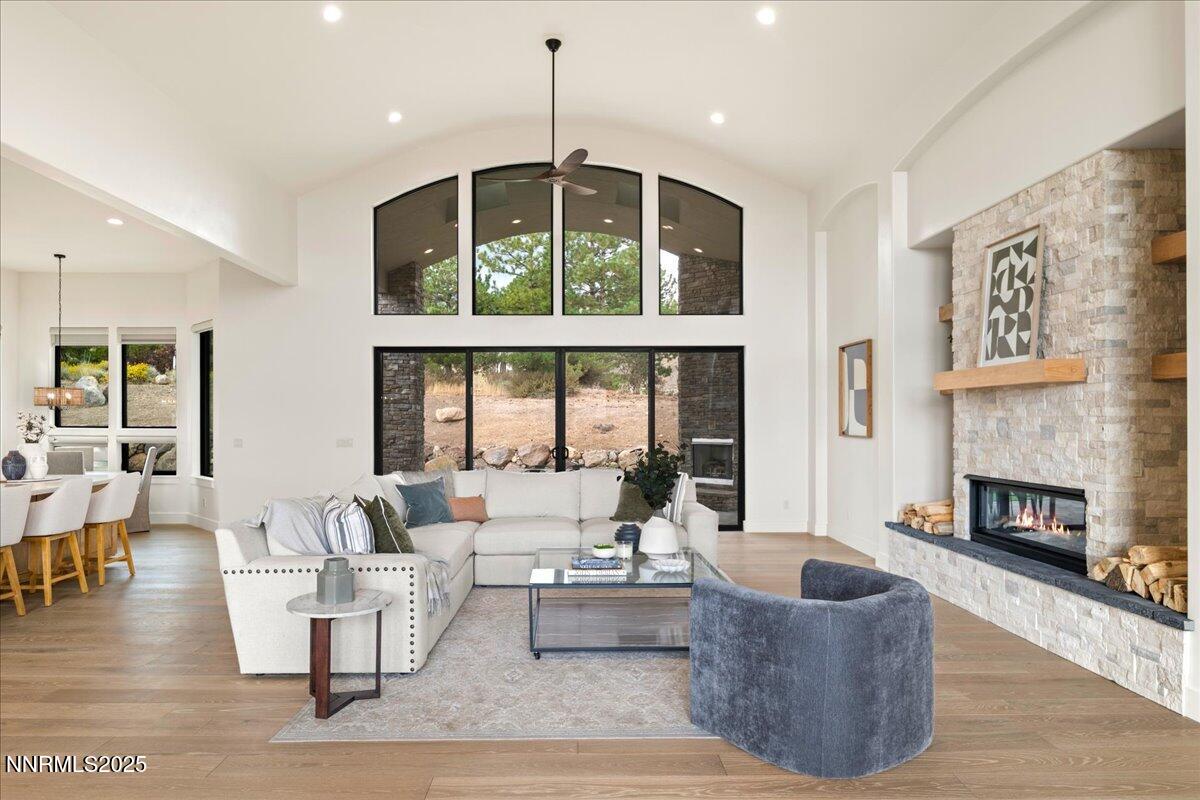 10755 Renegade Court Reno, NV 89511 - Photo 7 of 60 a living room with furniture large window and a fireplace