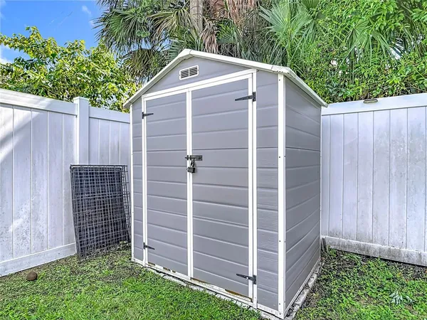 an aerial view of a house with a swimming pool