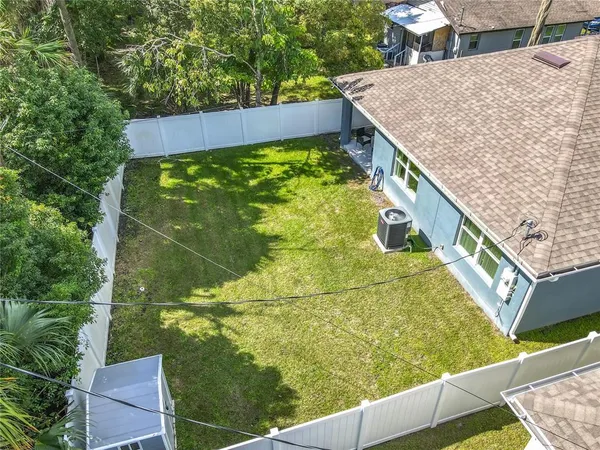 an aerial view of a house with a garden