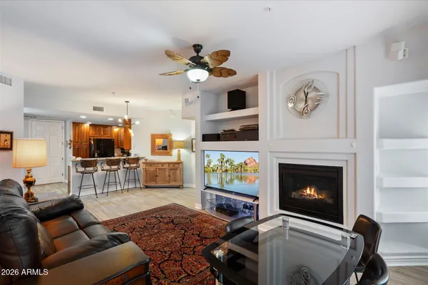 a living room with furniture and a fireplace