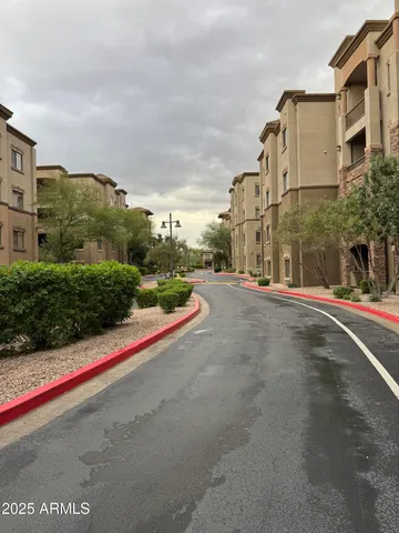 a view of street with large building
