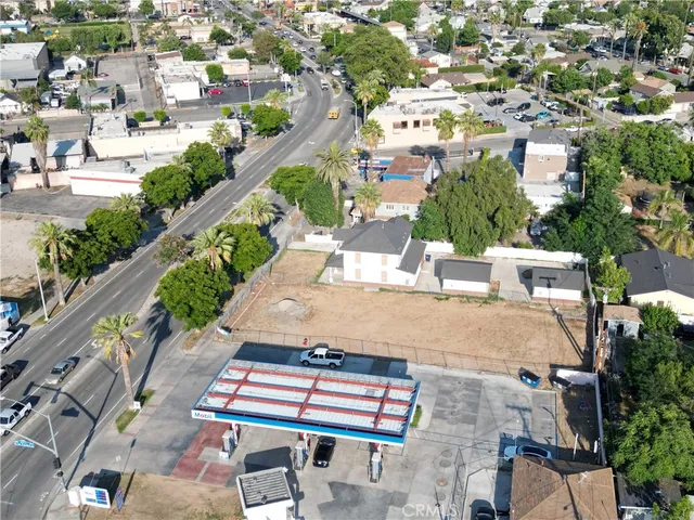 an aerial view of a multi story parking building with outdoor space