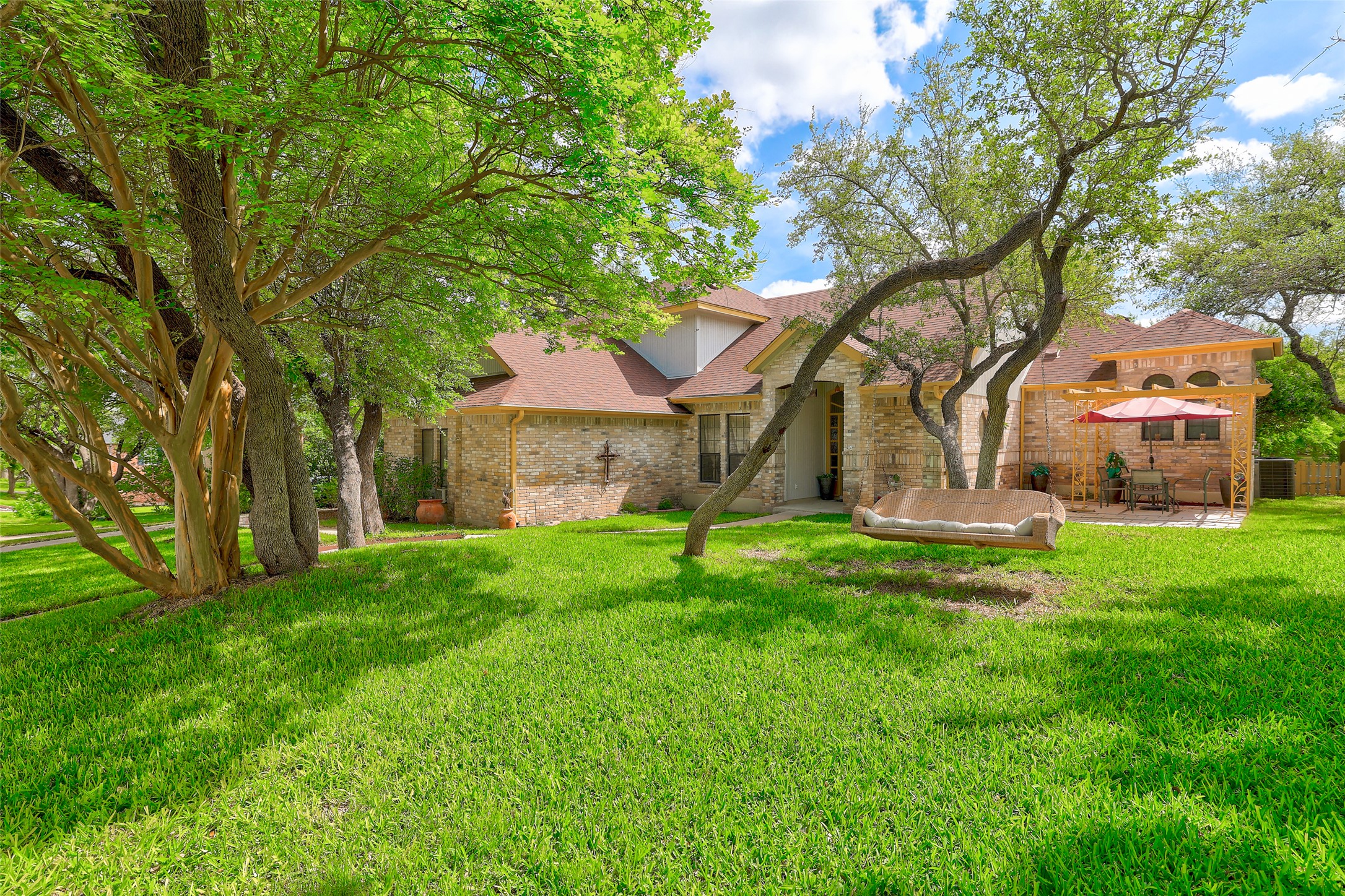 110 South Ridge Circle Georgetown, TX 78628 - Photo 2 of 37 Brick-clad exterior with a brown shingle roof